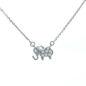 Minimalist diamond elephant pendant 18k white gold and 18-inch adjustable chain.