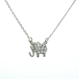 Minimalist diamond elephant pendant 18k white gold and 18-inch adjustable chain.