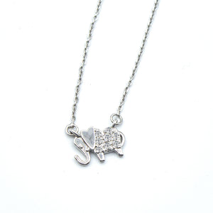 Minimalist diamond elephant pendant 18k white gold and 18-inch adjustable chain.